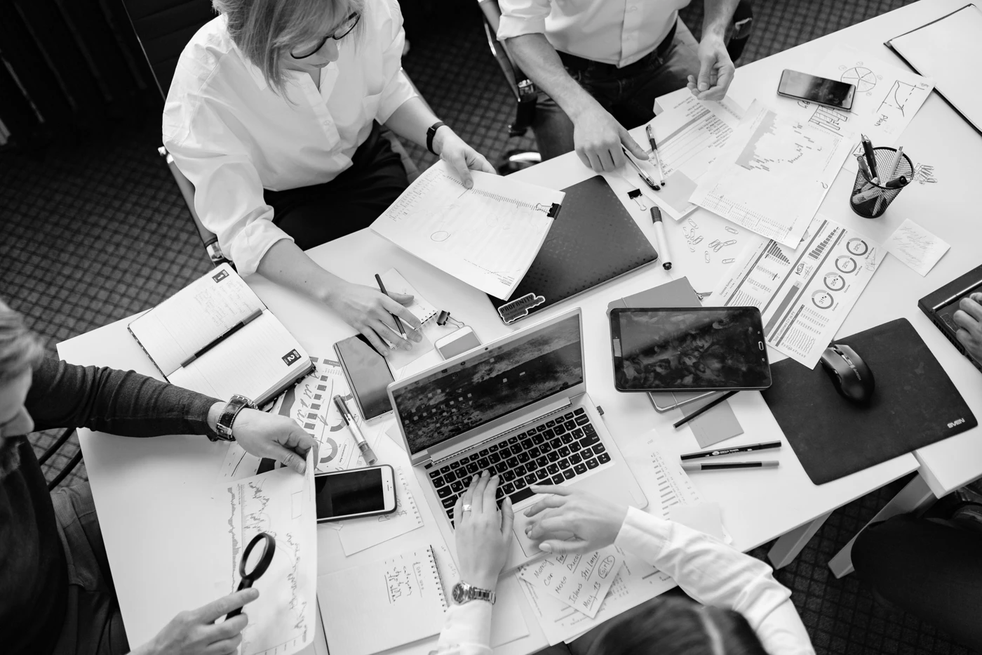 Overhead view of a creative planning session, from the company credentials